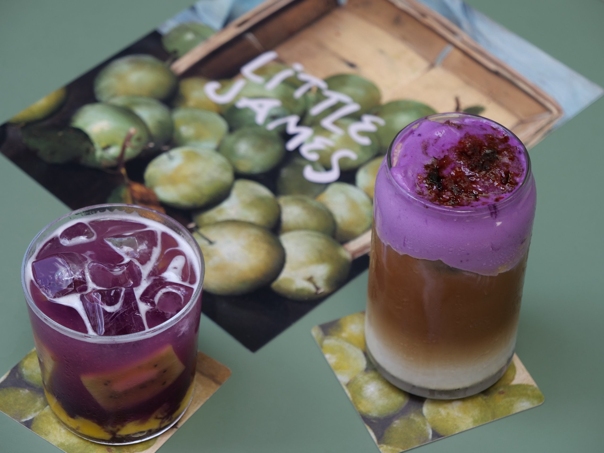 Little James's Latte to Libation pairing: a butterfly pea tea libation and an ube vanilla cold foam latte side by side